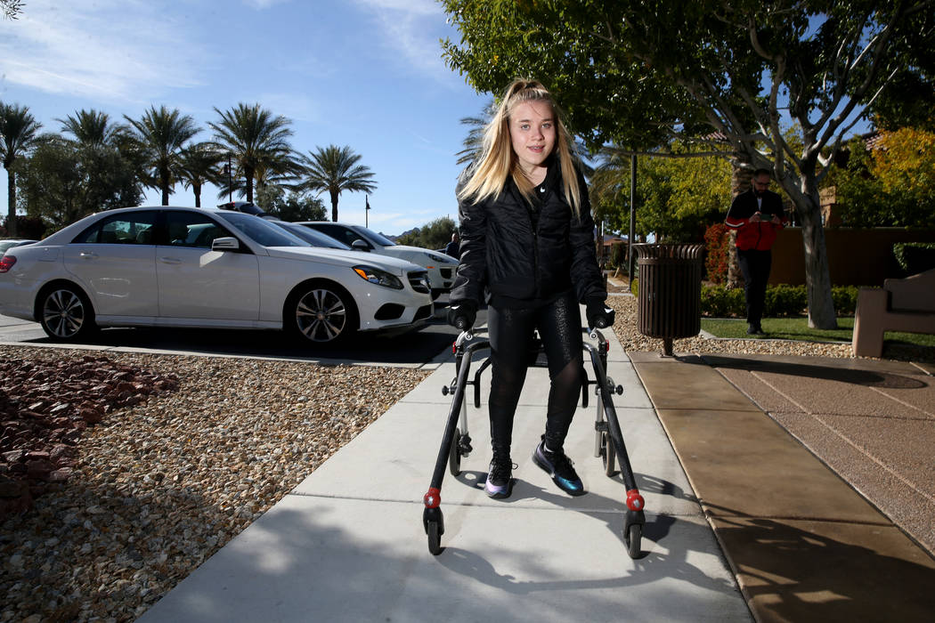 Philomena "Mena" Hawkins, 17, on a training walk near her Las Vegas home Tuesday, Nov. 26, 2019 ...