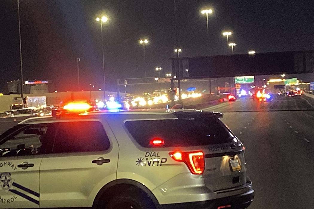 A Nevada Highway Patrol vehicle blocks Interstate 15 as troopers investigate a fatal, wrong-way ...