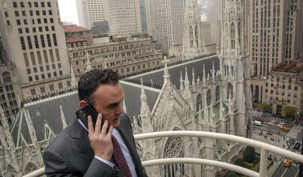 In this Tuesday, Oct. 29, 2019, photo, attorney Adam Slater takes a phone call on a patio outsi ...