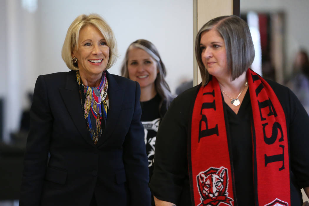 Secretary of Education Betsy DeVos, left, is seen during her visit to Pinecrest Academyճ ...