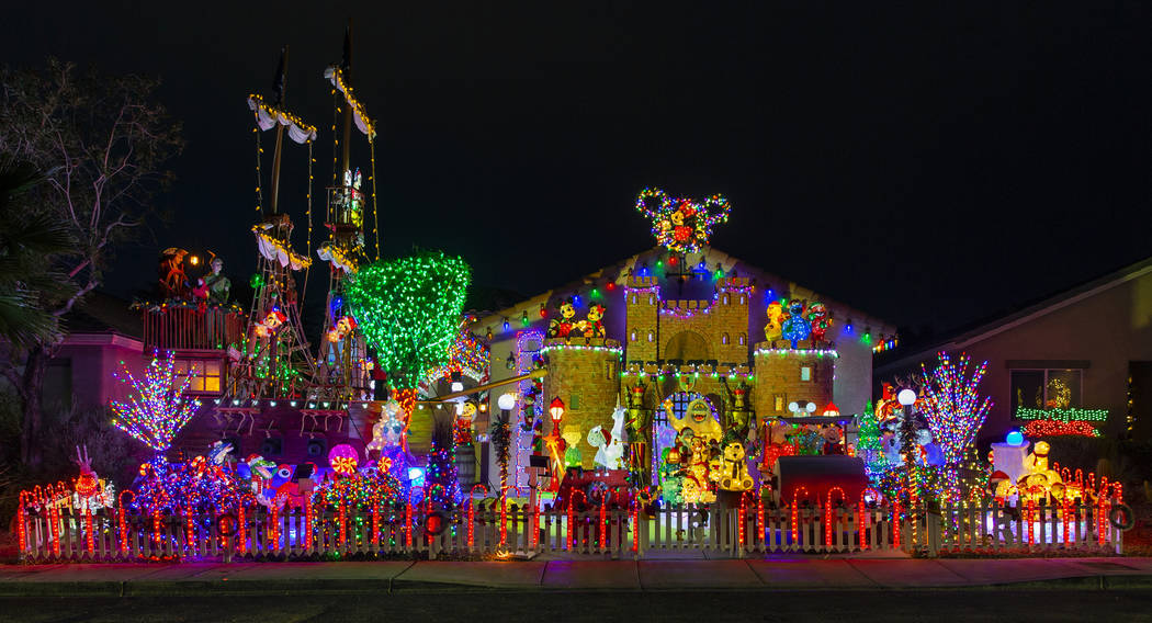 Thousands of holiday lights in the yard of Maria Acosta and Juan Torres which will be featured ...