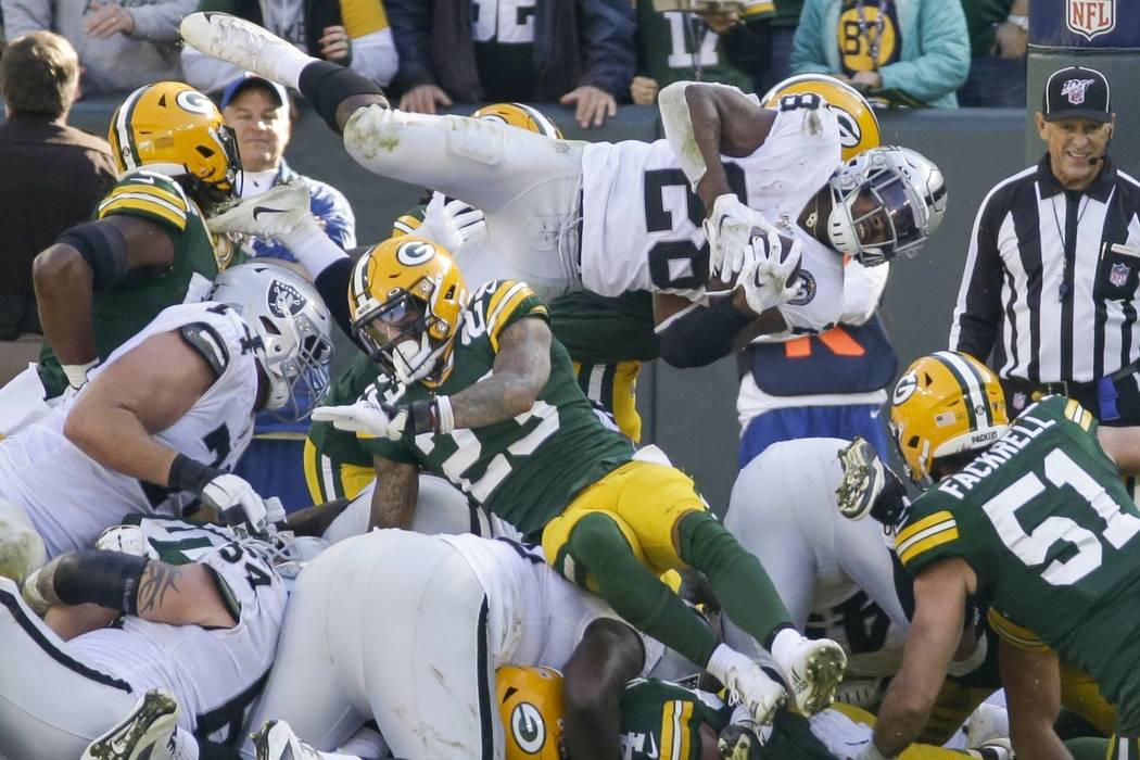 Oakland Raiders' Josh Jacobs is stopped on a fourth down run during the second half of an NFL f ...