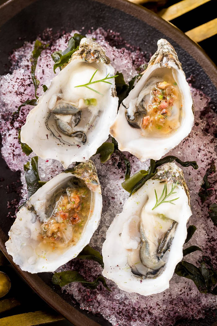 Wood grilled naked cowboy oysters with lemon miso butter and chilled French kiss oysters, Thai ...