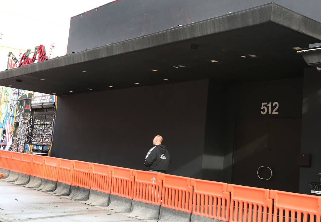 A pedestrian walks past a nightclub, previously known as Red, at 512 Fremont Street on Tuesday, ...