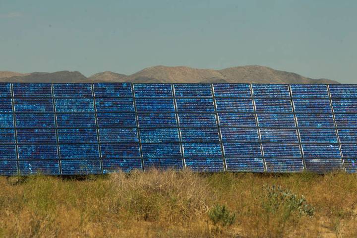 Solar panels generate power on the rim of Bilby crater within the Nevada National Security Test ...