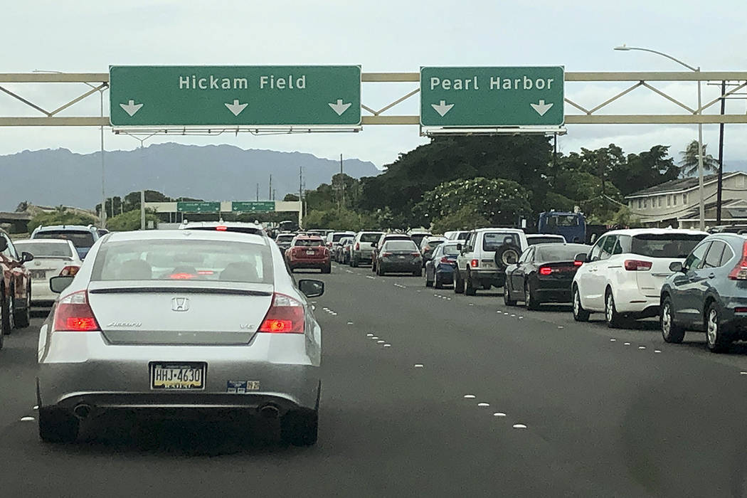 Traffic backs up at the main gates after a shooting at Pearl Harbor Naval shipyard, Wednesday, ...