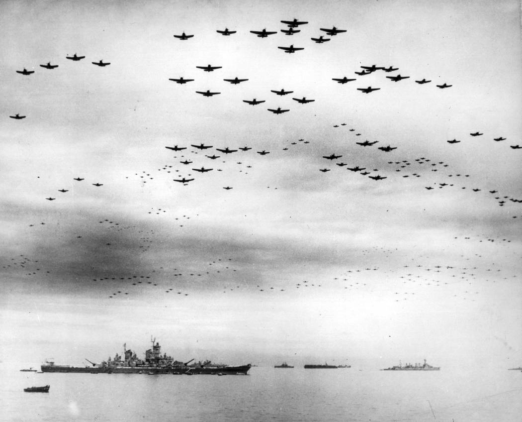 FILE - In this Sept. 2, 1945 file image provided by the U.S. Navy, F4U and F6F fighter planes f ...