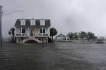 In a Sept. 14, 2018, file photo, high winds and water surround a house as Hurricane Florence hi ...