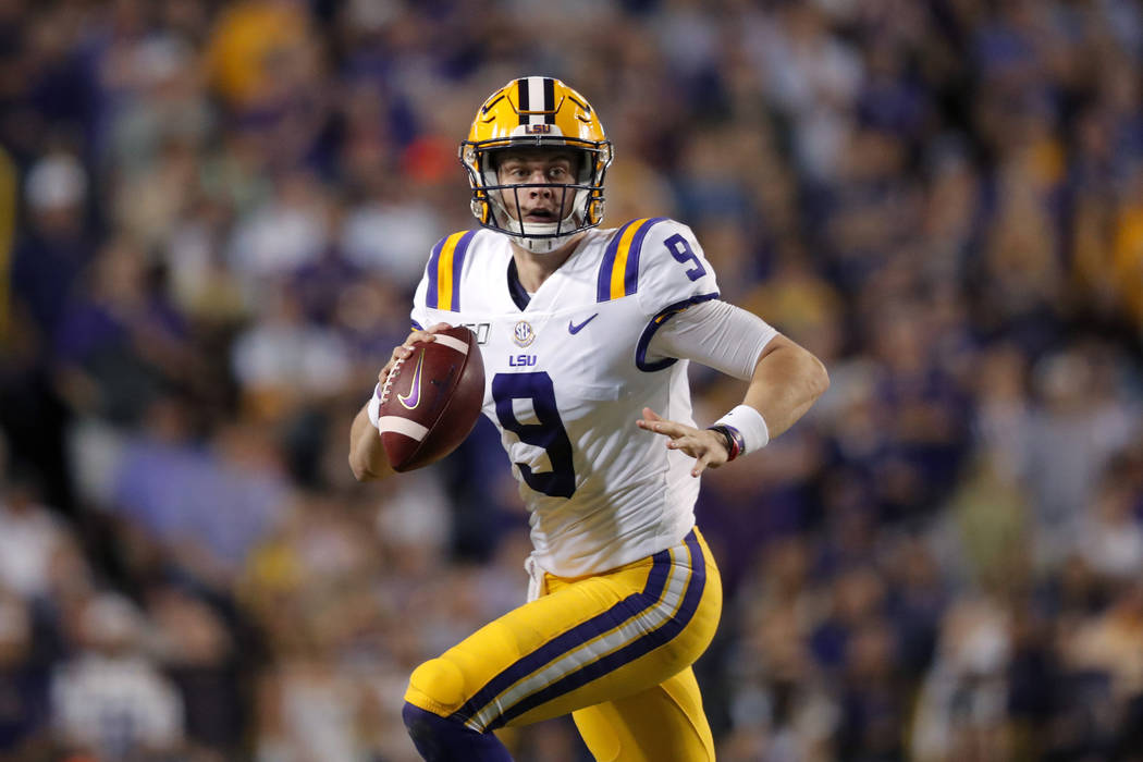 LSU quarterback Joe Burrow (9) scrambles during the first half of an NCAA college football game ...