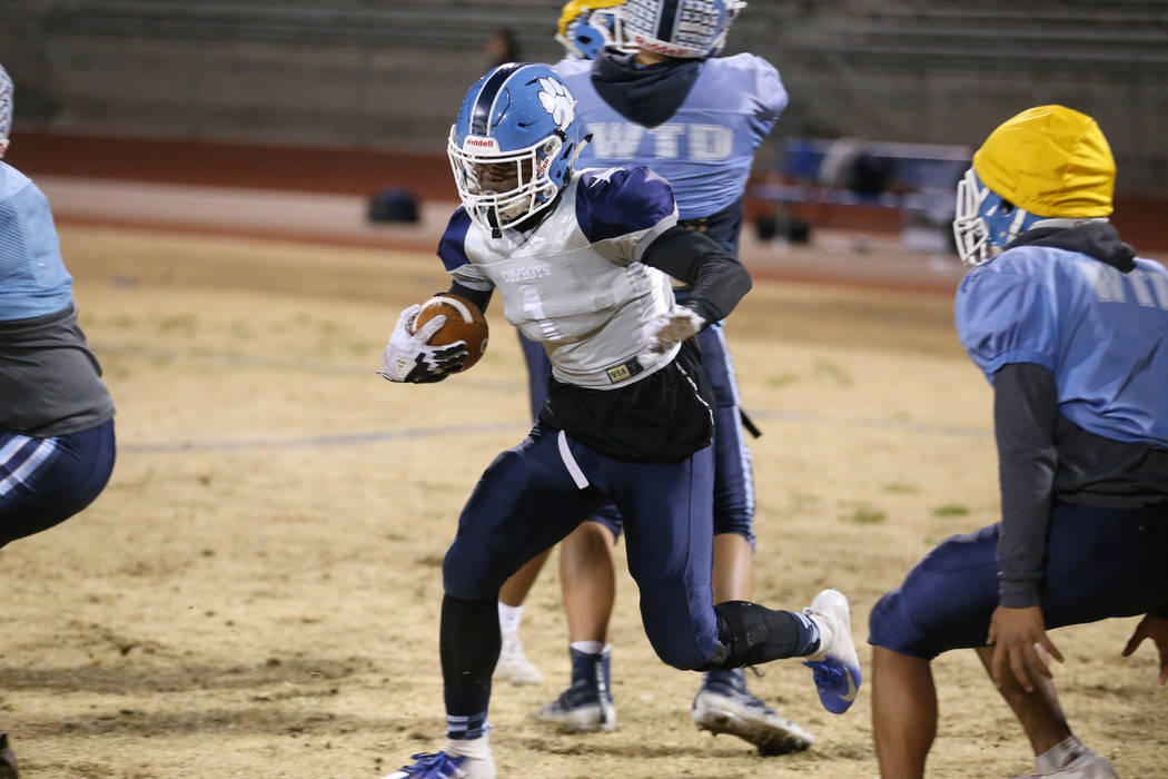 Centennial's running back Jordan Smith runs the ball during a team practice at Centennial High ...