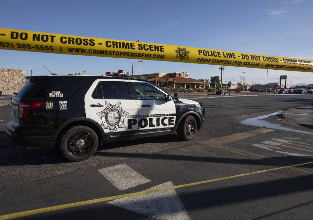Las Vegas police respond to a barricade situation with an armed male near the 100 block of Bel ...