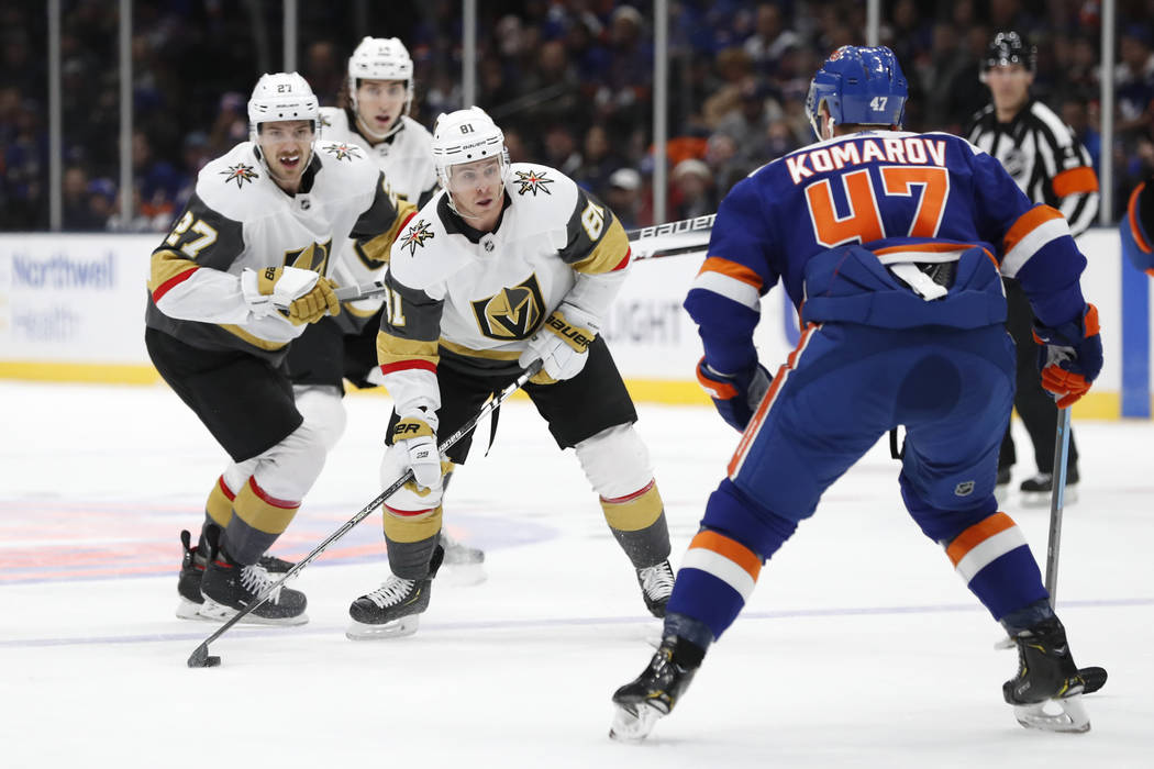 Vegas Golden Knights center Jonathan Marchessault (81) and defensemen Shea Theodore (27) and Ni ...