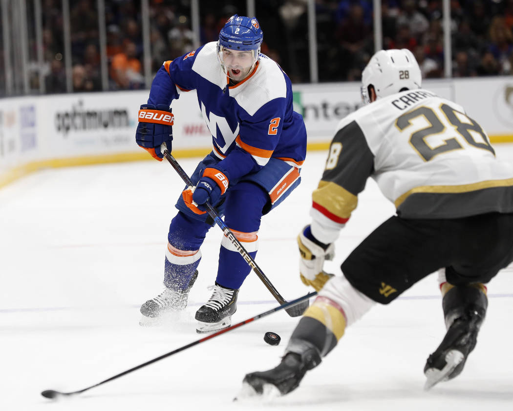 New York Islanders defenseman Nick Leddy (2) tries to skate past Vegas Golden Knights left wing ...