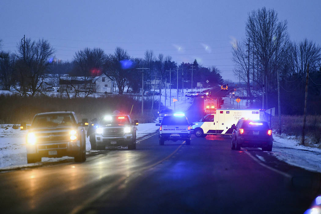 Emergency vehicles line the road near the scene of a helicopter crash Thursday, Dec. 5, 2019, n ...