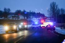 Emergency vehicles line the road near the scene of a helicopter crash Thursday, Dec. 5, 2019, n ...