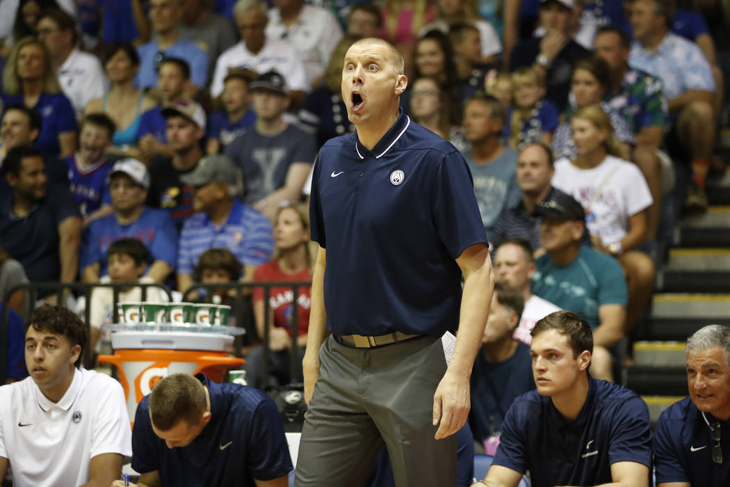 BYU head coach Mark Pope reacts to play as his team takes on Kansas during the first half of an ...