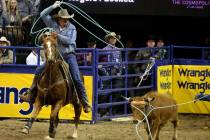 Kyle Lockett of Visalia, Calif. competes in Team Roping with Erich Rogers of Round Rock, Ariz. ...