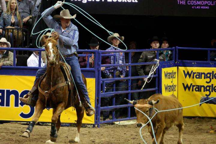 Kyle Lockett of Visalia, Calif. competes in Team Roping with Erich Rogers of Round Rock, Ariz. ...