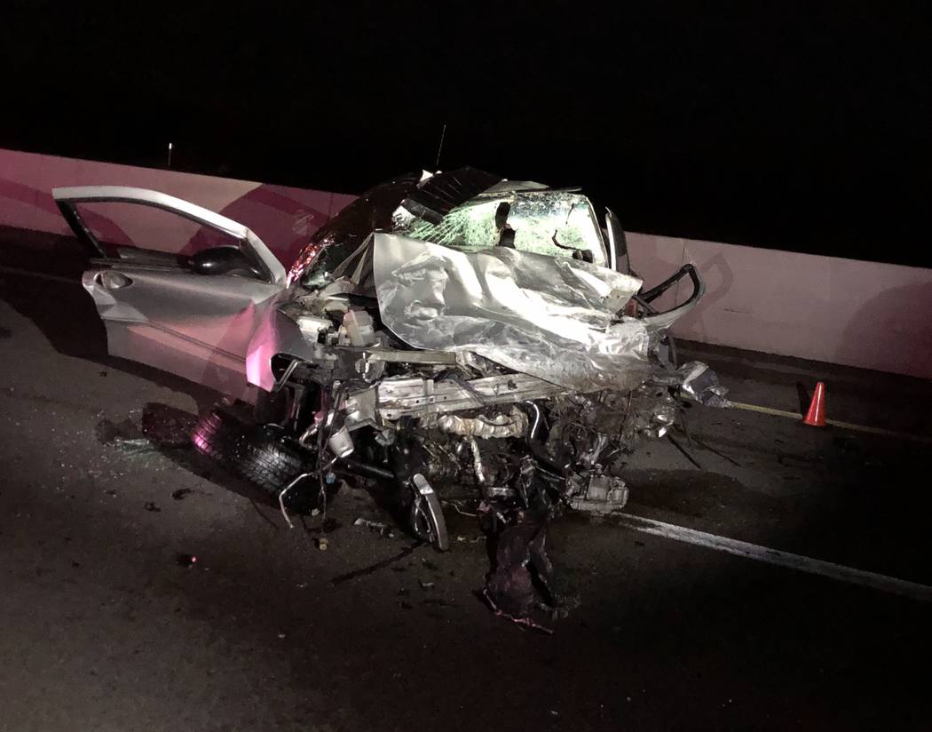 The remains of a vehicle involved in a wrong-way crash that left two people dead on Thursday, D ...