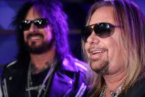 Nikki Sixx, left, and Vince Neil of Motley Crue are interviewed following a news conference to ...