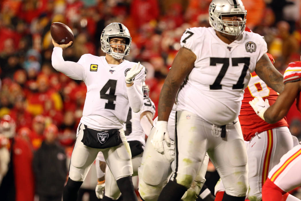 Oakland Raiders quarterback Derek Carr (4) throws the football as offensive tackle Trent Brown ...