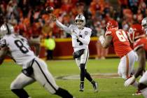 Oakland Raiders quarterback Derek Carr (4) throws a pass as Kansas City Chiefs defensive tackle ...