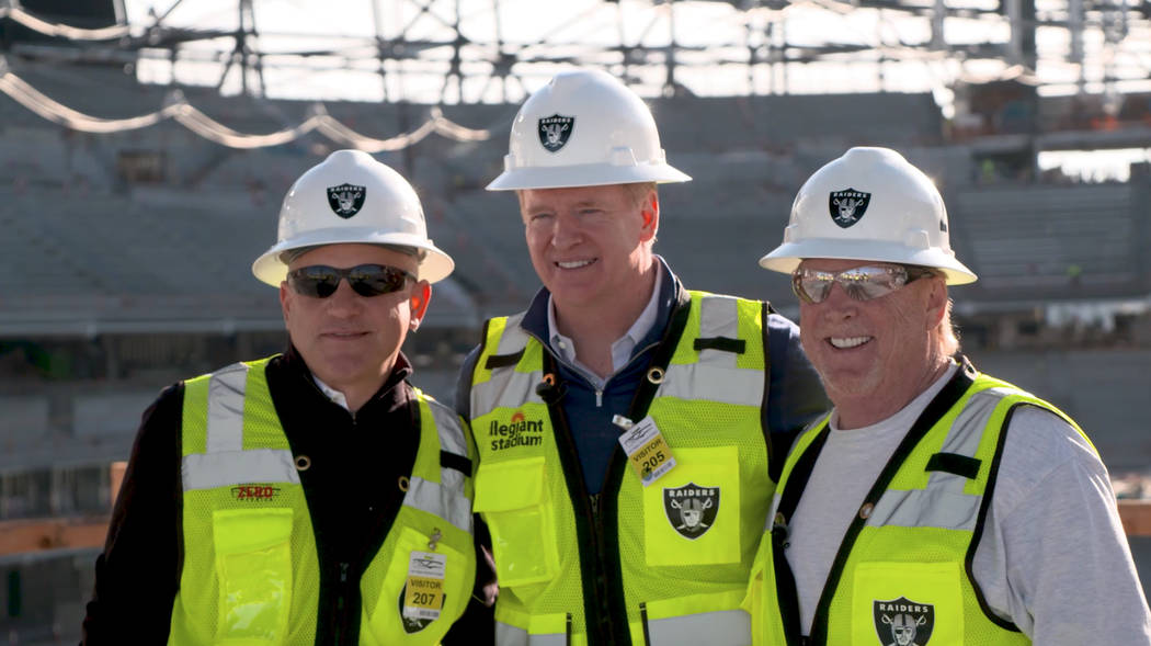 Raiders team president Marc Badain, NFL commissioner Roger Goodell and Raiders owner Mark Davis ...