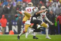 San Francisco 49ers free safety Jimmie Ward (20) looses control of the ball against Baltimore R ...