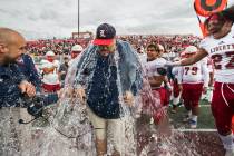 Liberty coach Rich Muraco is given a Gatorade bath after defeating Centennial 50-7 to win the C ...