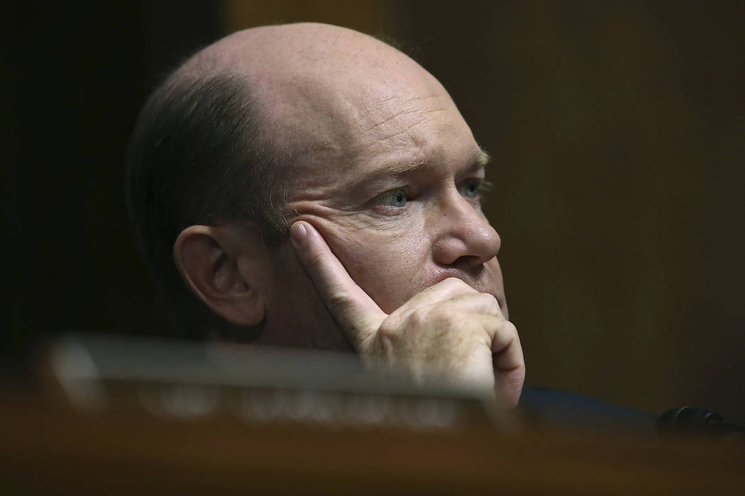 Sen. Chris Coons, D-Del., listens to testimony from Christine Blasey Ford during a Senate Judic ...