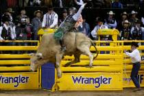 Jeff Askey of Athens, Texas, rides Yellow Fever during Bull Riding in the second go-around of t ...
