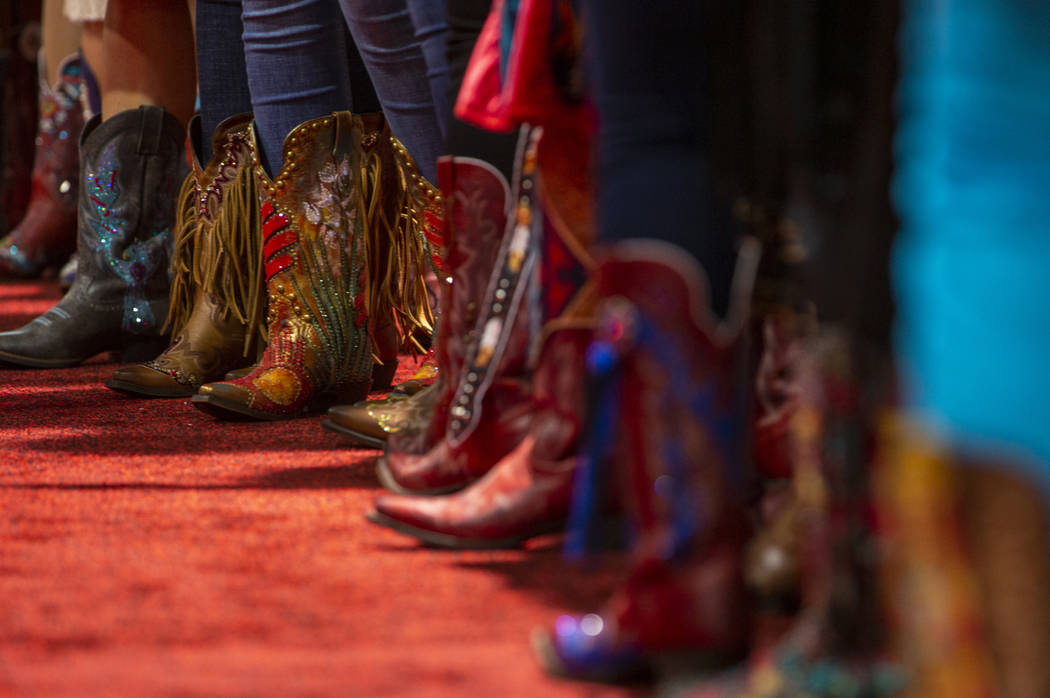 Contestants line up wearing their personally-designed boots for the Miss Rodeo America Justin B ...