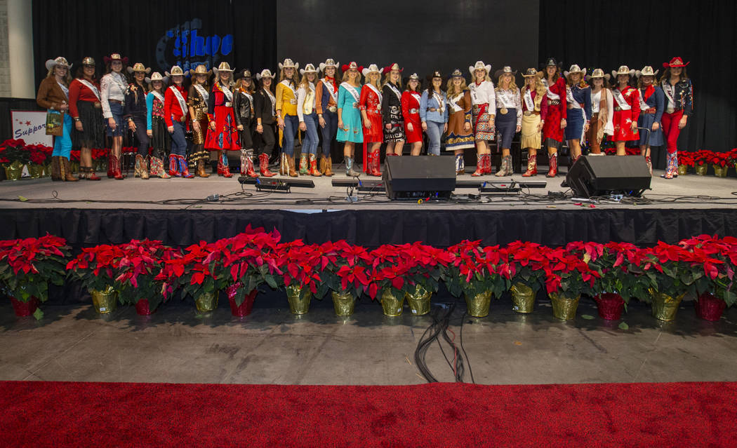 Contestants take the stage following the Miss Rodeo America Justin Boot Parade during Cowboy Ch ...