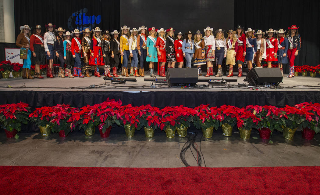 Contestants take the stage following the Miss Rodeo America Justin Boot Parade during Cowboy Ch ...