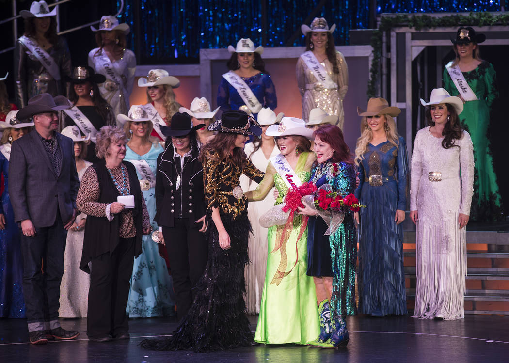 Miss Rodeo South Dakota Jordan Tierney, center, reacts after winning Miss Rodeo America next to ...