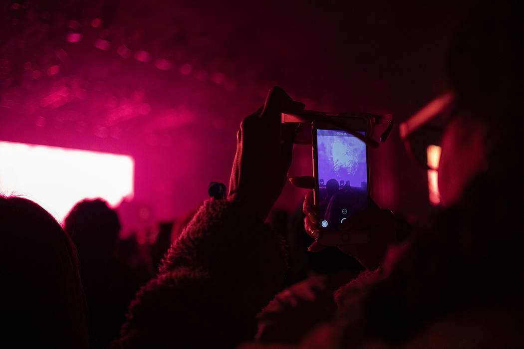 An audience member at Flying Lotus's set films through their 3D glasses on Saturday, Dec. 7, 20 ...