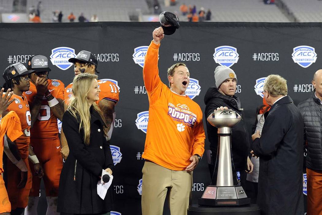 Clemson head coach Dabo Swinney, center, celebrates following the Atlantic Coast Conference cha ...