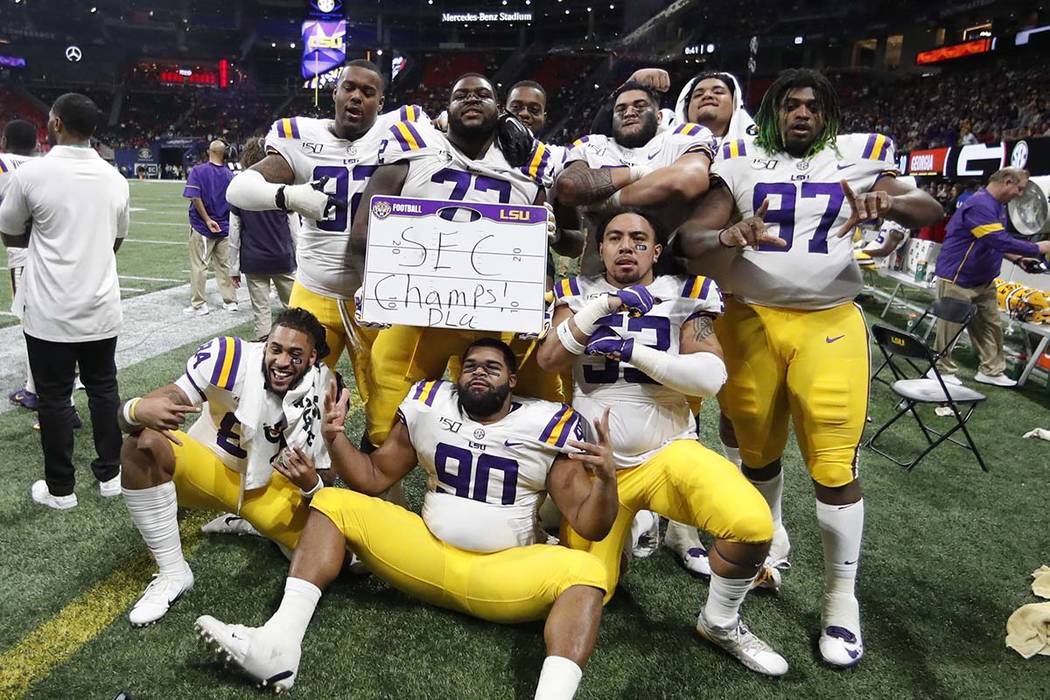 LSU players celebrate after the Southeastern Conference championship NCAA college football game ...
