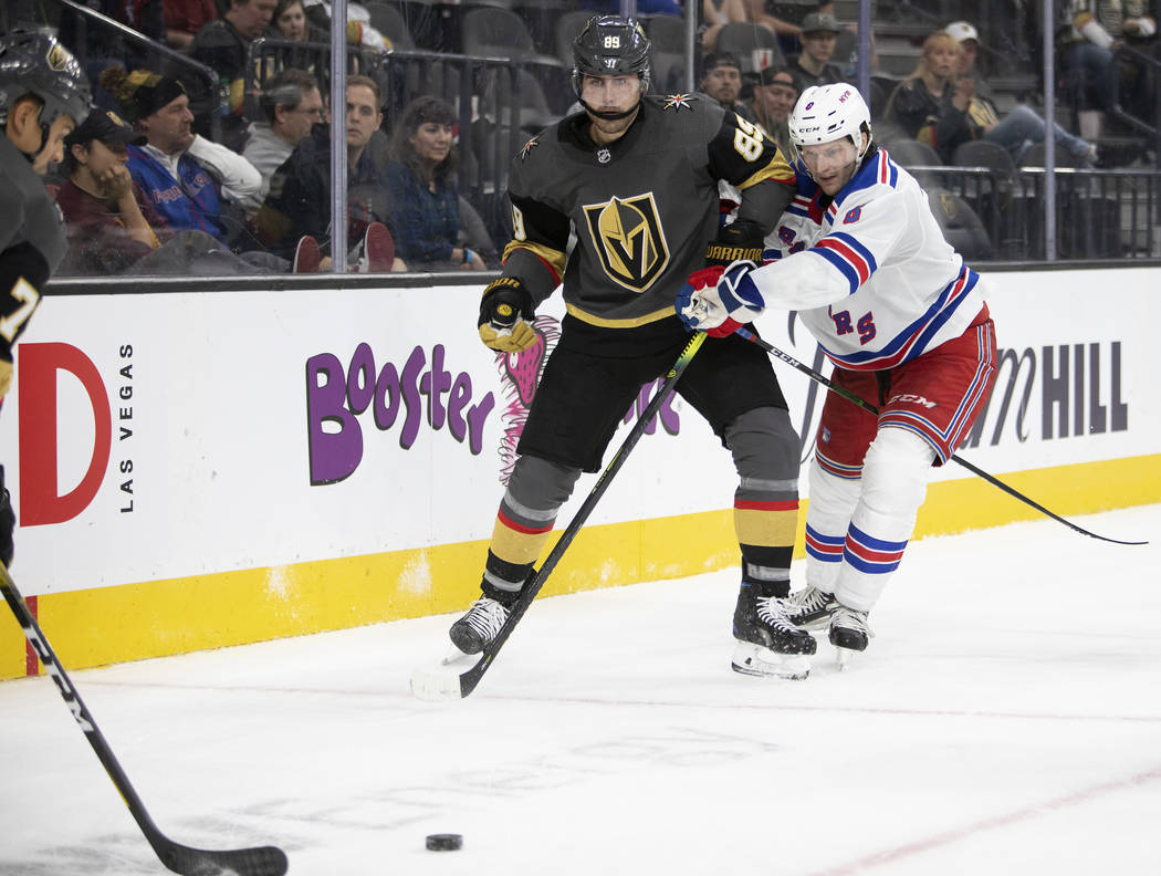 Golden Knights right wing Alex Tuch (89) eyes the puck after passing as New York Rangers defens ...