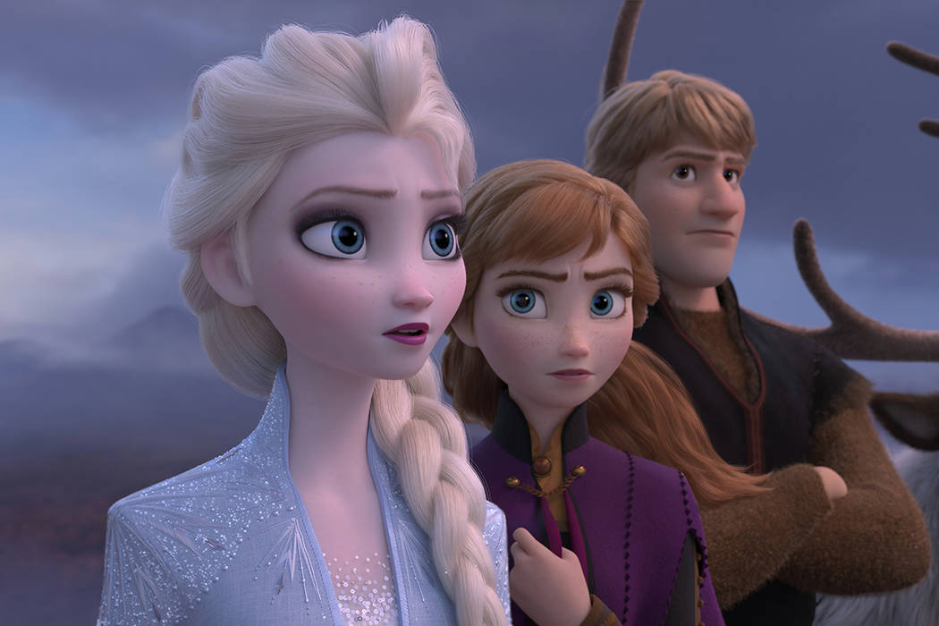 This image released by Disney shows Elsa, voiced by Idina Menzel, from left, Anna, voiced by Kr ...