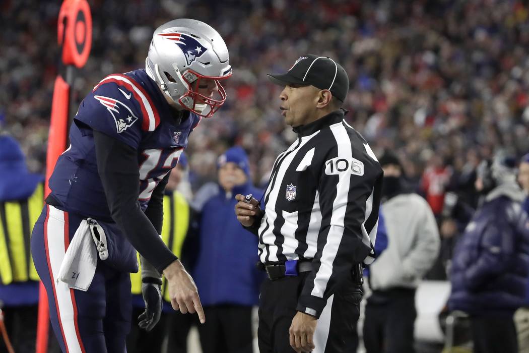 New England Patriots quarterback Tom Brady appeals to down judge Patrick Holt that wide receive ...