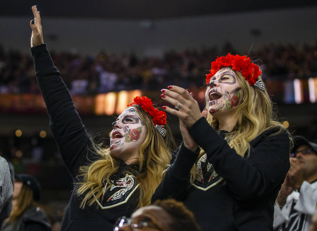 Erin Colegrove and Kharisma Rodriguez cheer a Vegas Golden Knights goal over the Winnipeg Jets ...