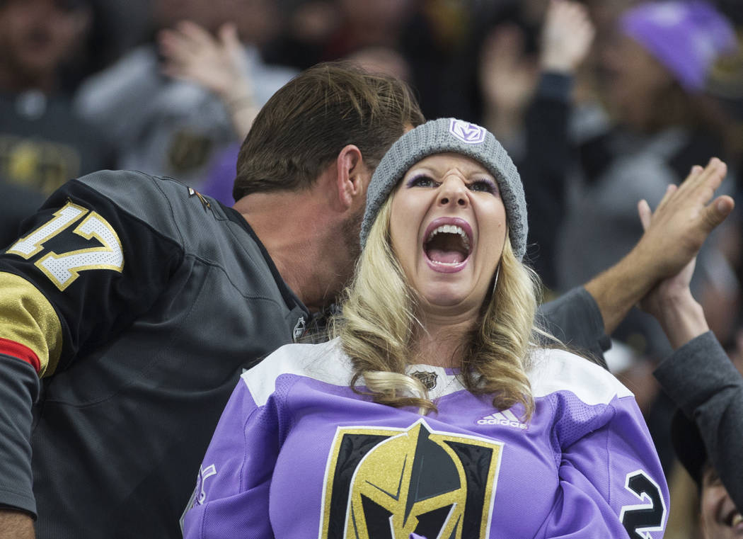 Golden Knights fans cheer for Vegas during their NHL hockey game with the San Jose Sharks on Th ...