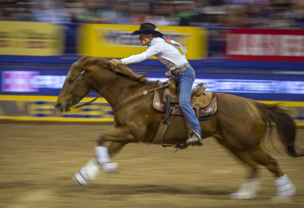 Dona Kay Rule of Minco, Okla., heads home in Barrel Racing during the third go round of the Wra ...