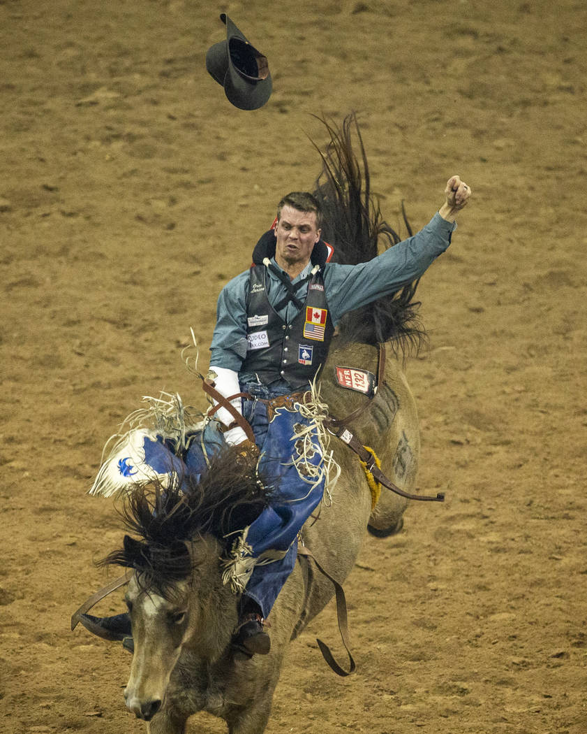 Orin Larsen of Inglis, Manitoba, rides Night Fist for 90.0 points and first place during the fo ...