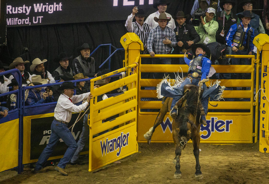 Rusty Wright of Milford, Utah, stays on top of Miss Nancy for a score of 89.5 points to take fi ...