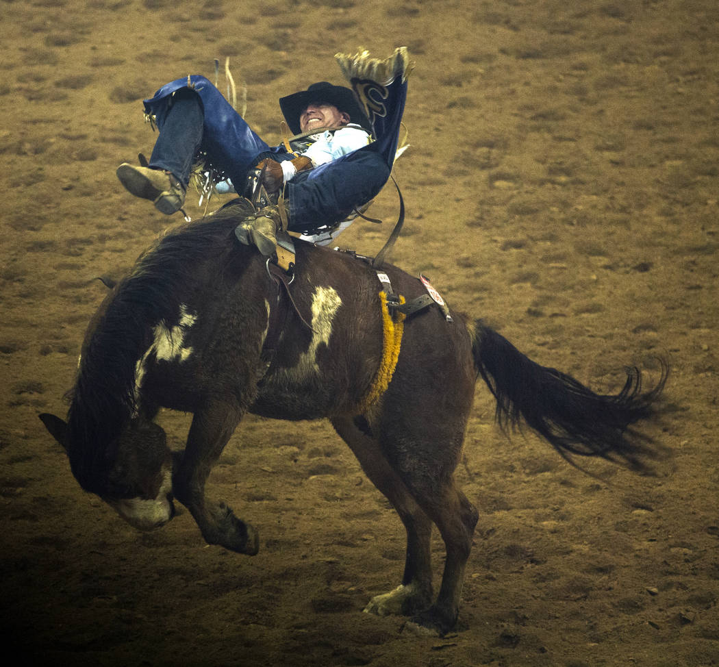 Trenten Montero of Winnemucca, Nev., rides Show Boat during Bareback Riding in the fourth go ro ...
