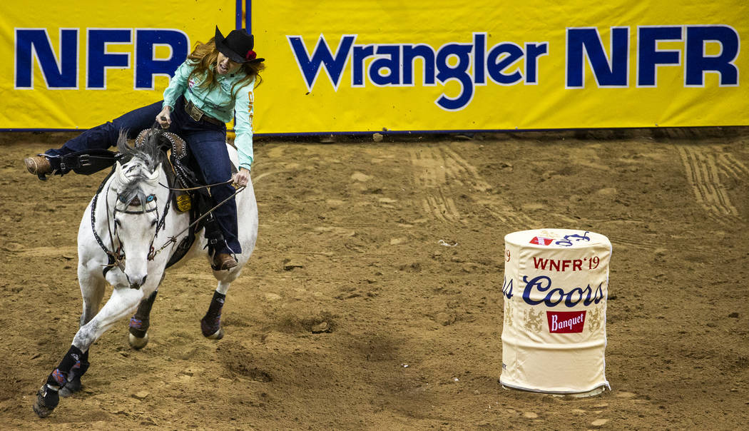 Emily Miller of Weatherford, Okla., turns for home on her way to a time of 13.64 seconds and a ...