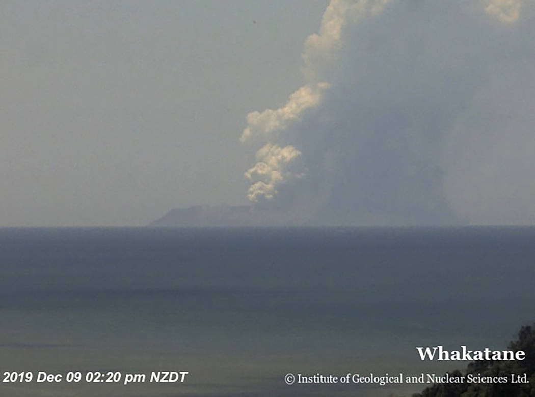 This image released by GNS Science, shows plumes of smoke from a volcanic eruption on White Isl ...
