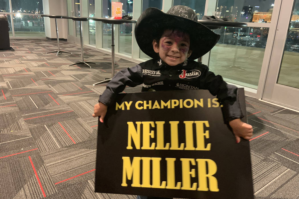 Aryia Ramos shows who she's rooting for -- star barrel racer Nellie Miller -- before Sunday nig ...